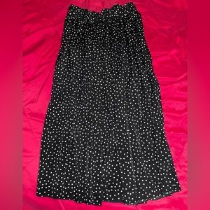 Black with white polka dots long skirt. Size L.